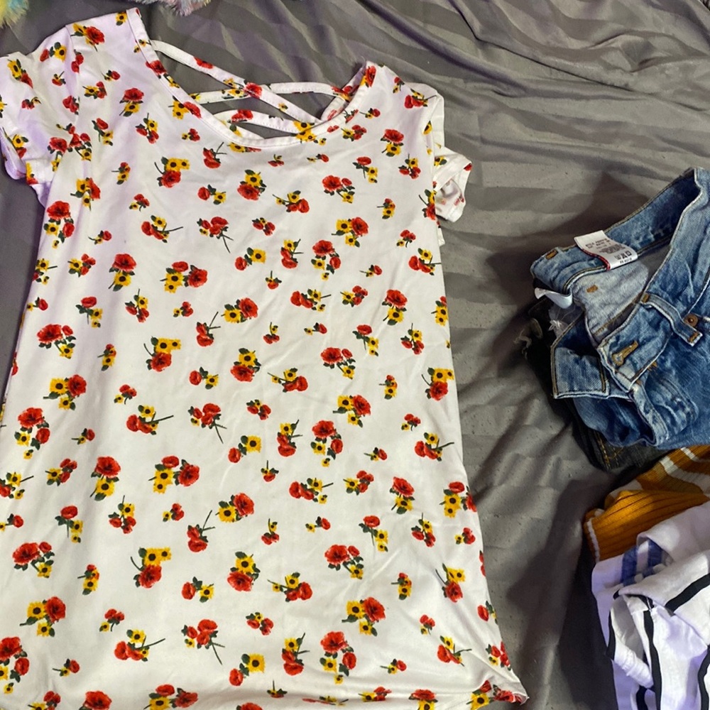 White shirt with flowers and a criss cross back